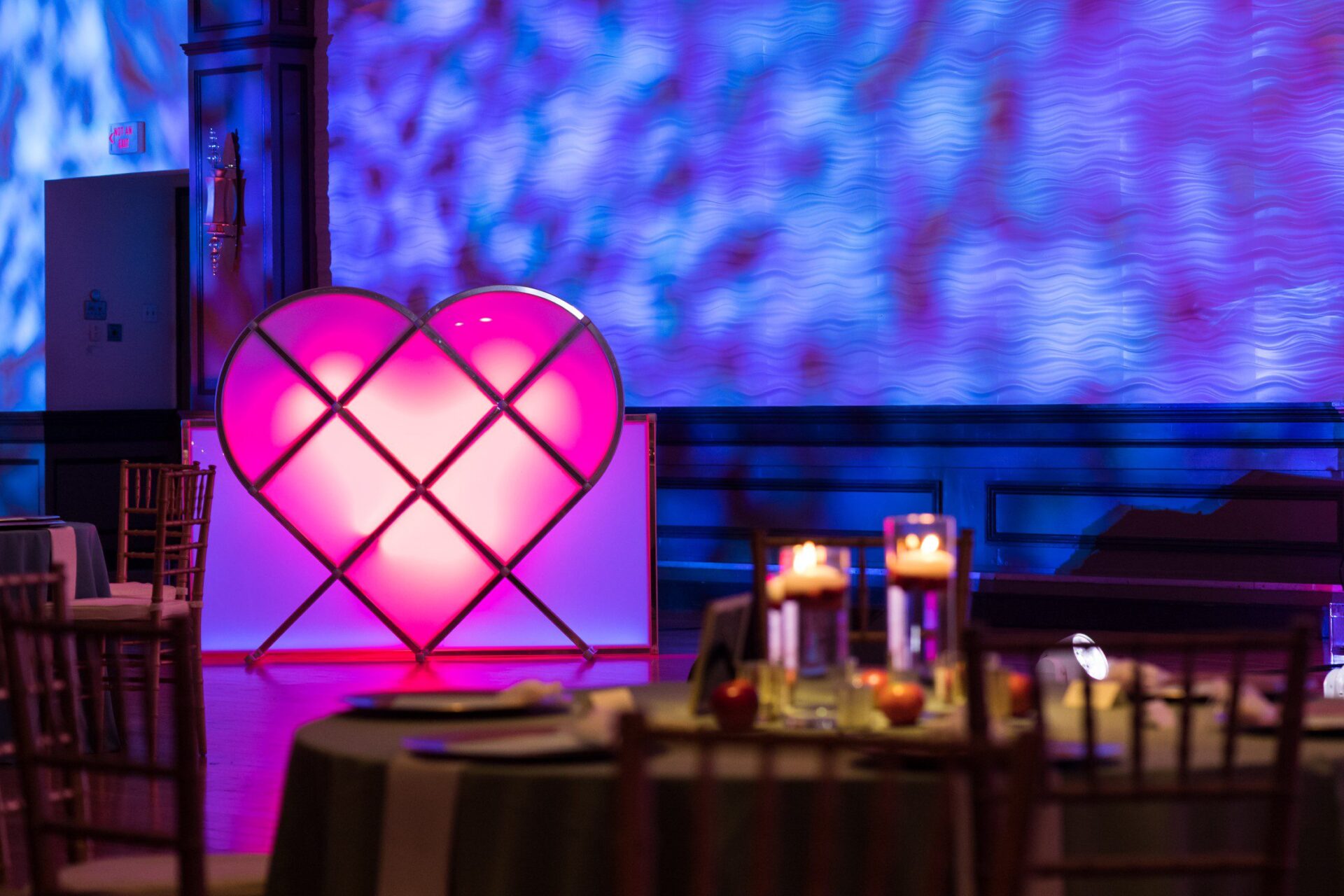 Custom pink heart-shaped DJ booth designed and built by Black Diamond Event Production for a wedding