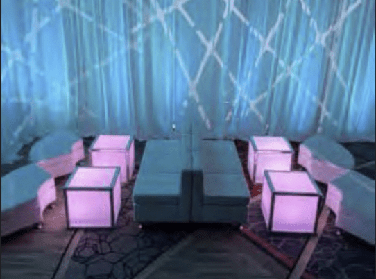 Custom bar setup with backlit shelving at a corporate gala in Boston, Massachusetts