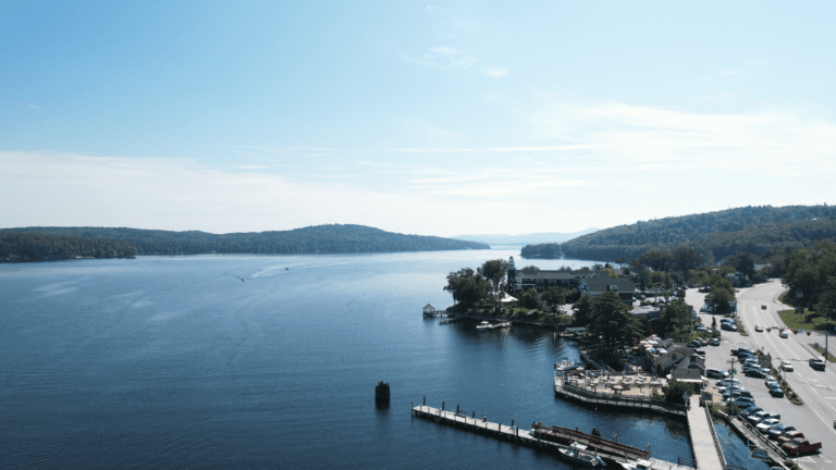 Drone shot of Meredith Bay at Lake Winnipesaukee overlooking the town docks and Church Landing