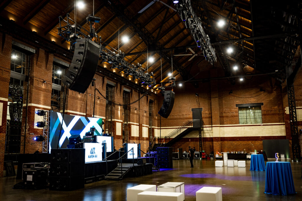 Conference stage with professional front wash lighting and backdrop projection