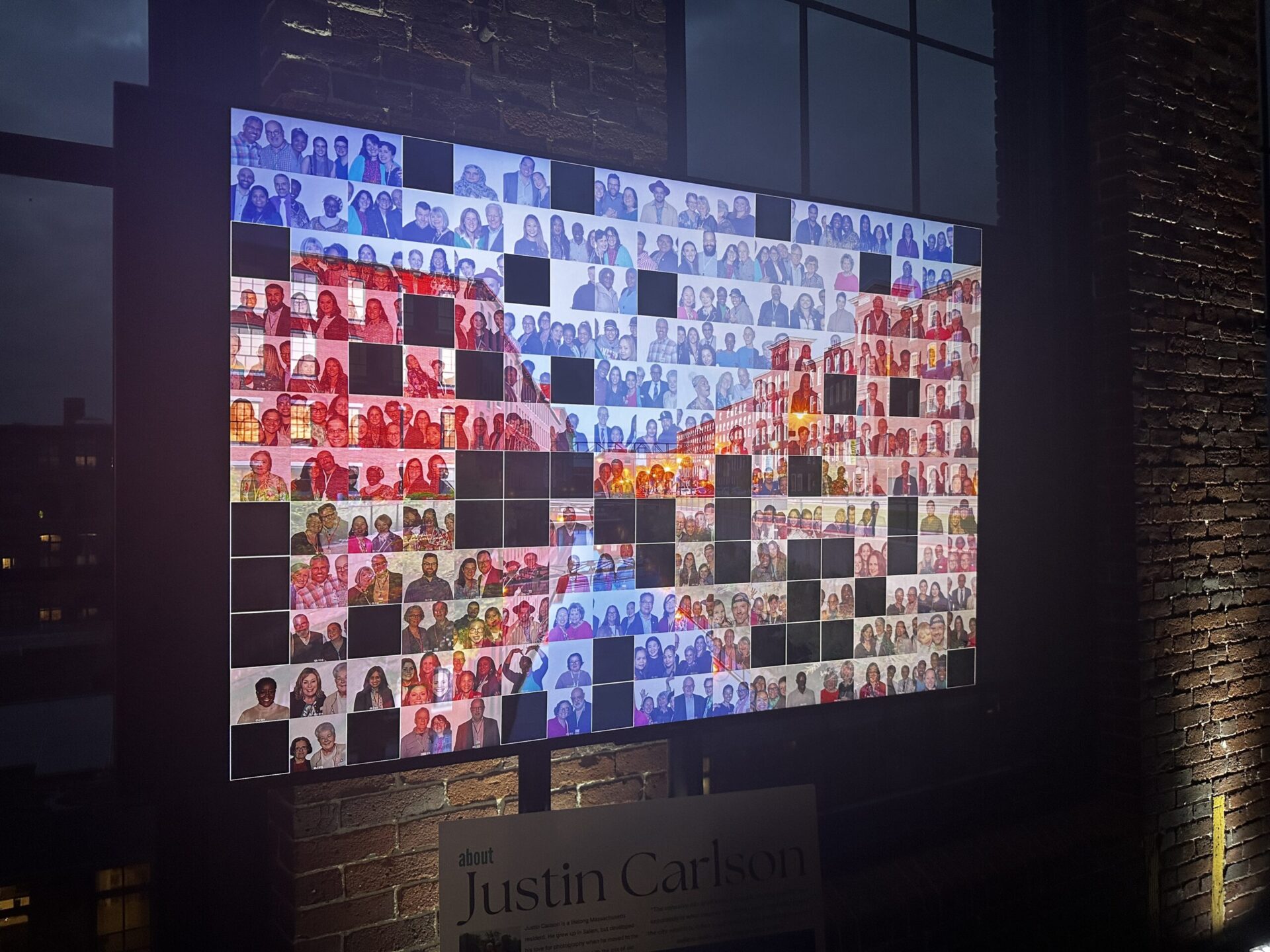 Close-up of digital mosaic display screen showing guest photos forming a mosaic at a New England event