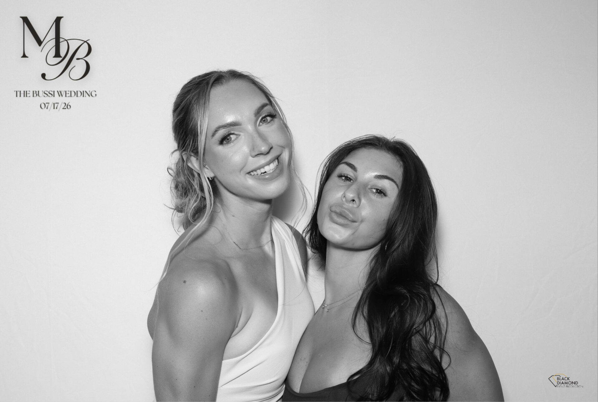 Black Diamond GLAM photo booth in action at a New England event, showing the dramatic monochrome style