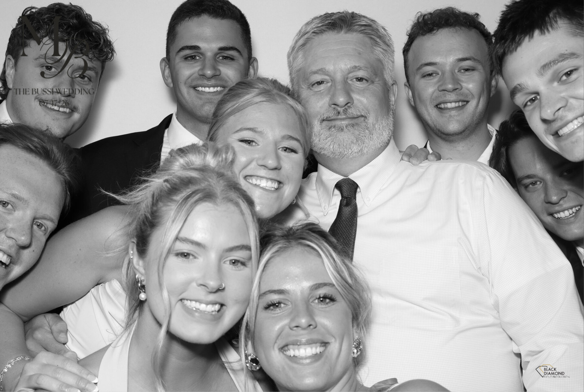 High-contrast black and white portrait from a Black Diamond GLAM photo booth showing the signature studio lighting effect